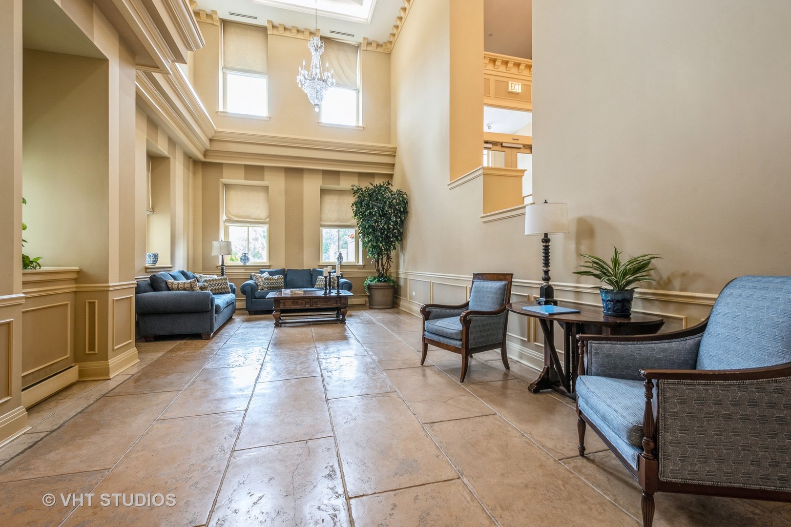 1041 Ridge Road, Unit 101 Wilmette, IL 60091 - Photo 3 of 14 a living room with furniture a table and a potted plant