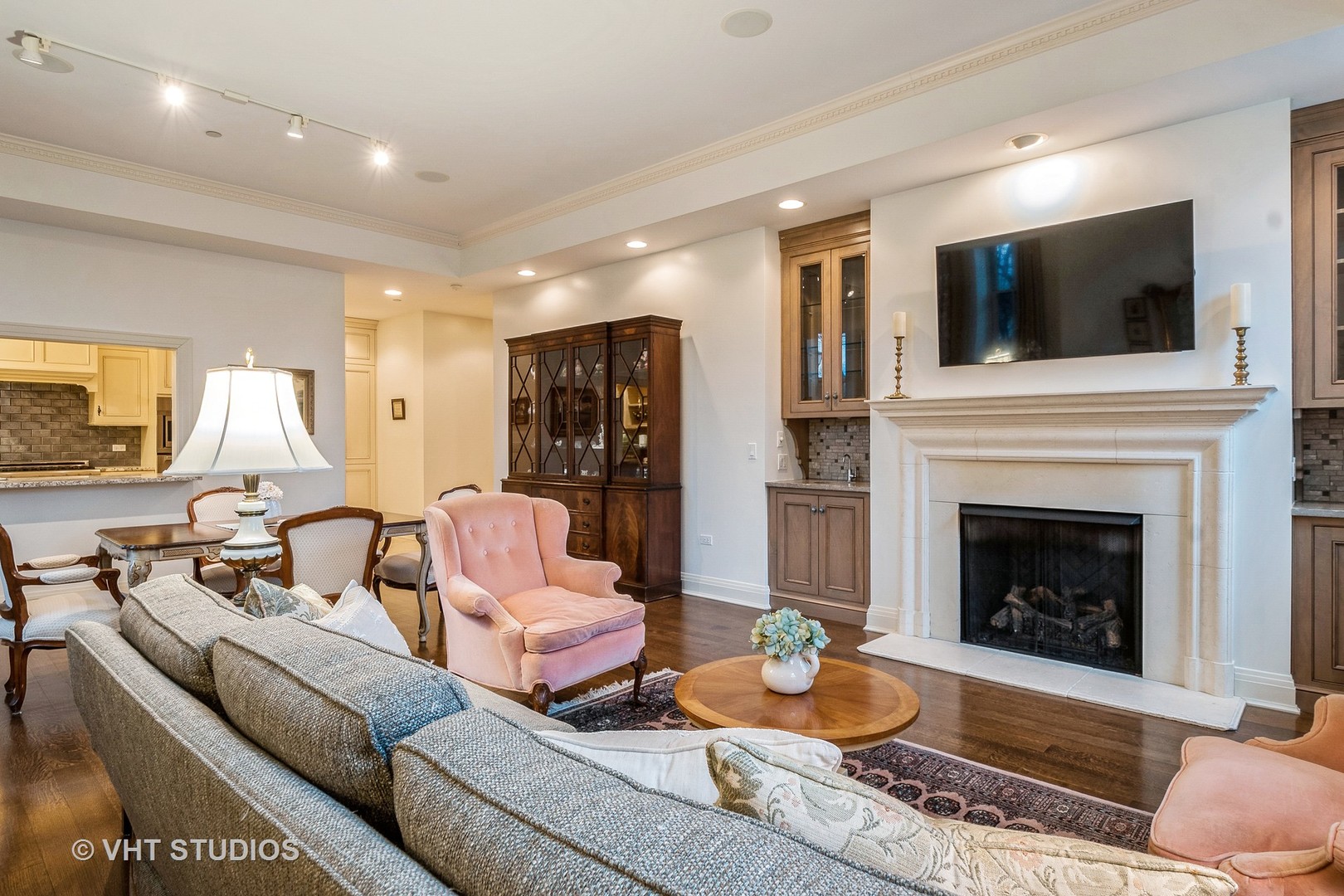 1041 Ridge Road, Unit 101 Wilmette, IL 60091 - Photo 5 of 14 a living room with furniture a flat screen tv and a fireplace