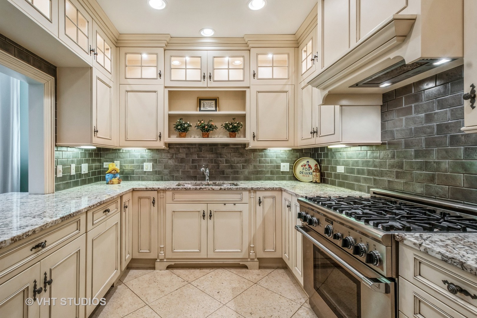 1041 Ridge Road, Unit 101 Wilmette, IL 60091 - Photo 7 of 14 a kitchen with cabinets appliances and a window