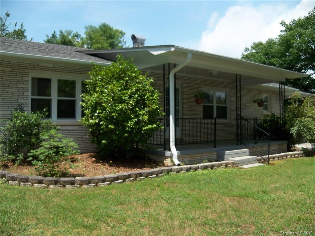 126 Pea Ridge Road Mill Spring, NC 28756 - Photo 1 of 24 front view of house with a yard