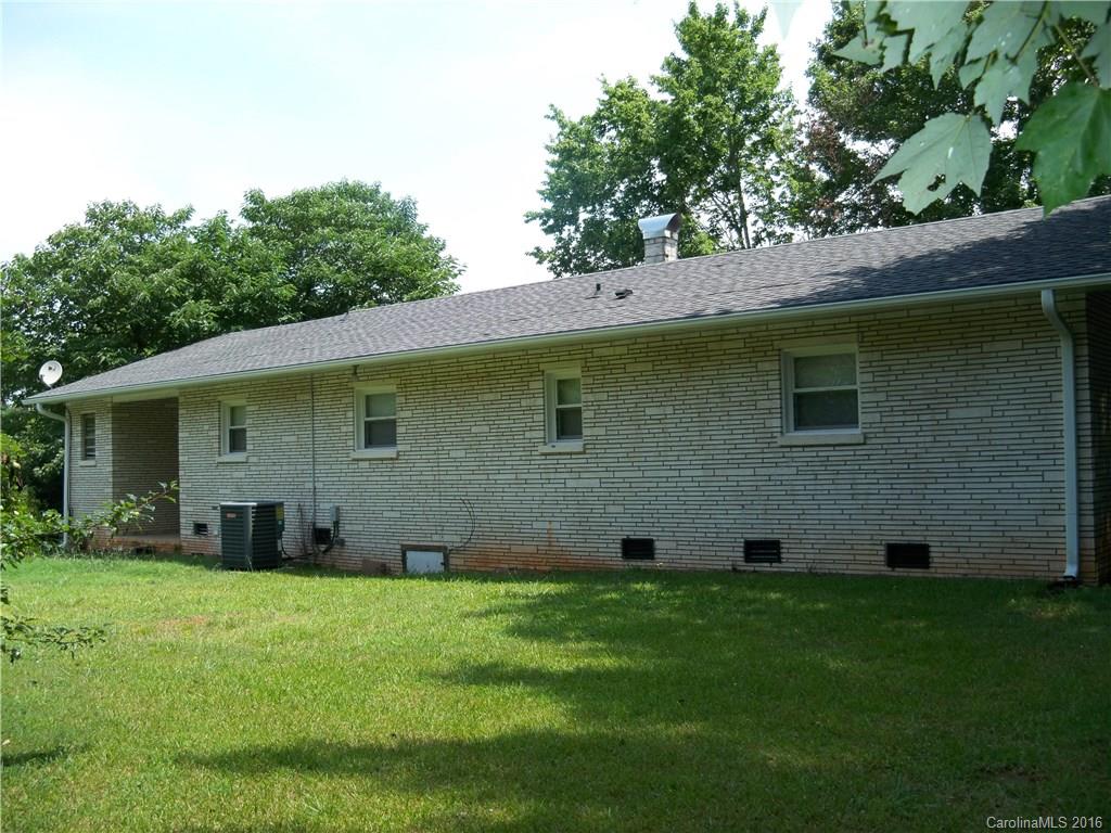 126 Pea Ridge Road Mill Spring, NC 28756 - Photo 2 of 24 a view of a house with a yard