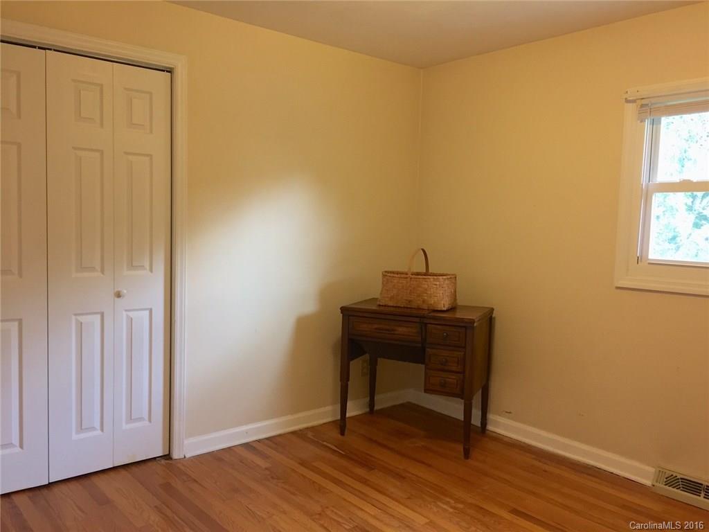 126 Pea Ridge Road Mill Spring, NC 28756 - Photo 14 of 24 a view of a workspace with wooden floor