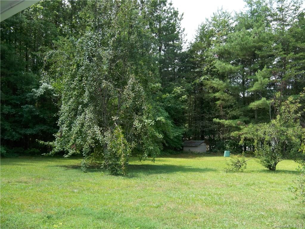 126 Pea Ridge Road Mill Spring, NC 28756 - Photo 16 of 24 a view of a field of grass and trees