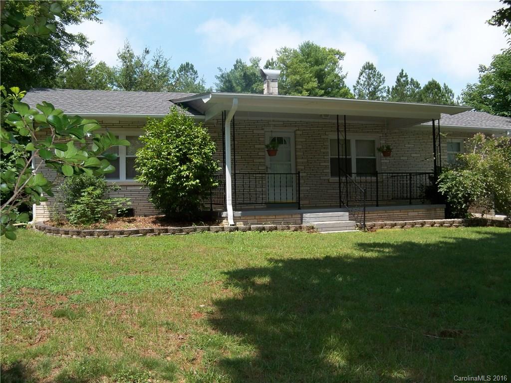 126 Pea Ridge Road Mill Spring, NC 28756 - Photo 24 of 24 a view of a back yard of the house