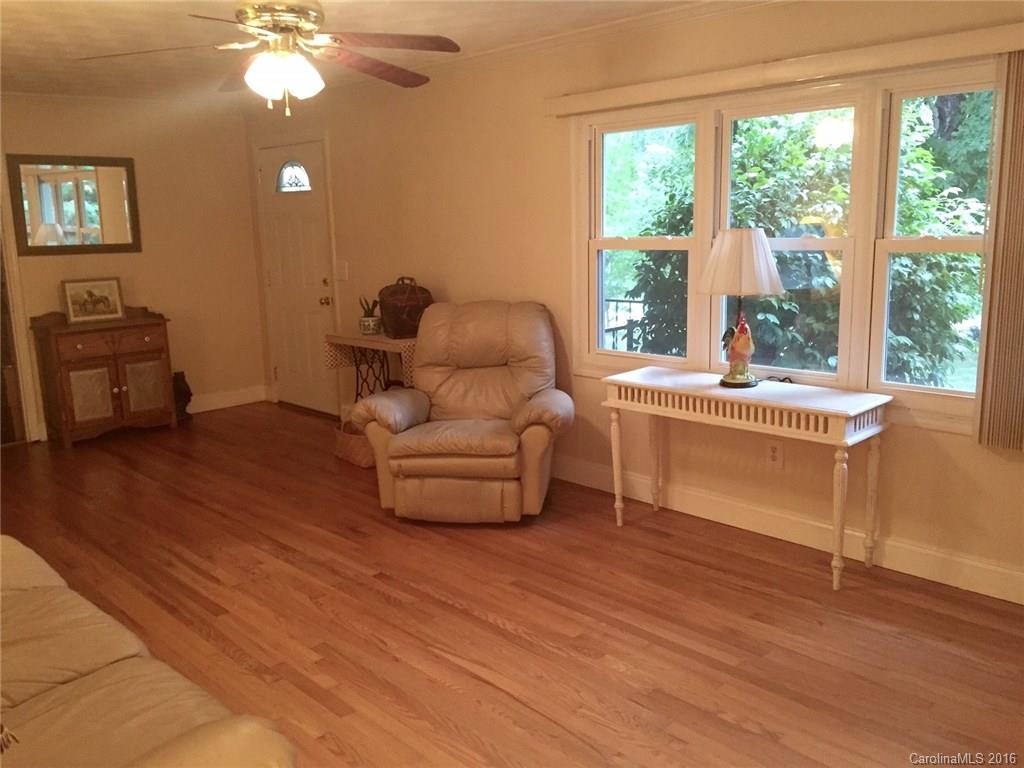 126 Pea Ridge Road Mill Spring, NC 28756 - Photo 4 of 24 a room with furniture and a large window