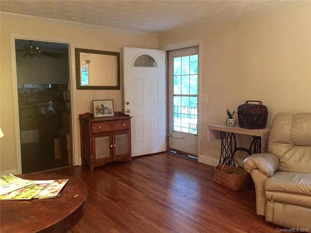 126 Pea Ridge Road Mill Spring, NC 28756 - Photo 5 of 24 a living room with furniture and a wooden floor
