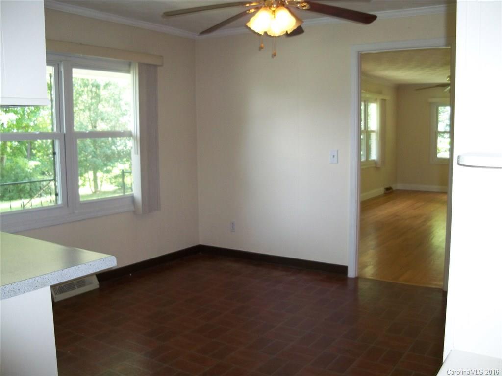 126 Pea Ridge Road Mill Spring, NC 28756 - Photo 10 of 24 an empty room with a window