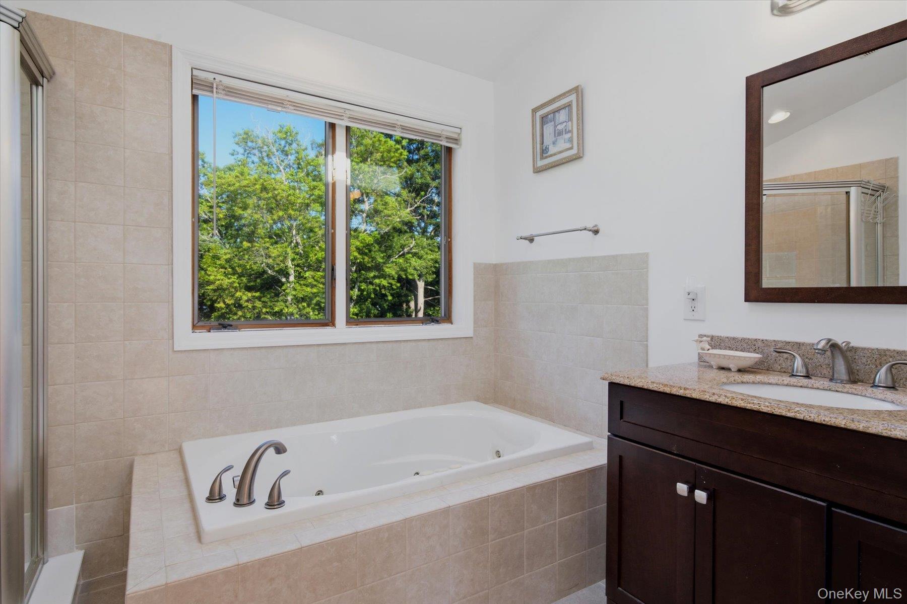 498 Miller Place Road Miller Place, NY 11764 - Photo 16 of 37 Beautiful Primary bathroom with Jacuzzi and shower.