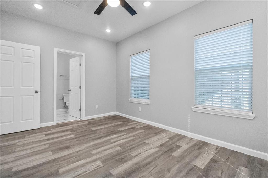 3512 Hamilton Avenue Dallas, TX 75210 - Photo 17 of 23 Unfurnished bedroom featuring light wood finished floors, ceiling fan, recessed lighting, and ensuite bath