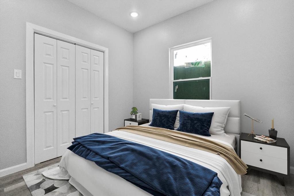 3512 Hamilton Avenue Dallas, TX 75210 - Photo 22 of 23 Bedroom featuring wood finished floors, a closet, and recessed lighting