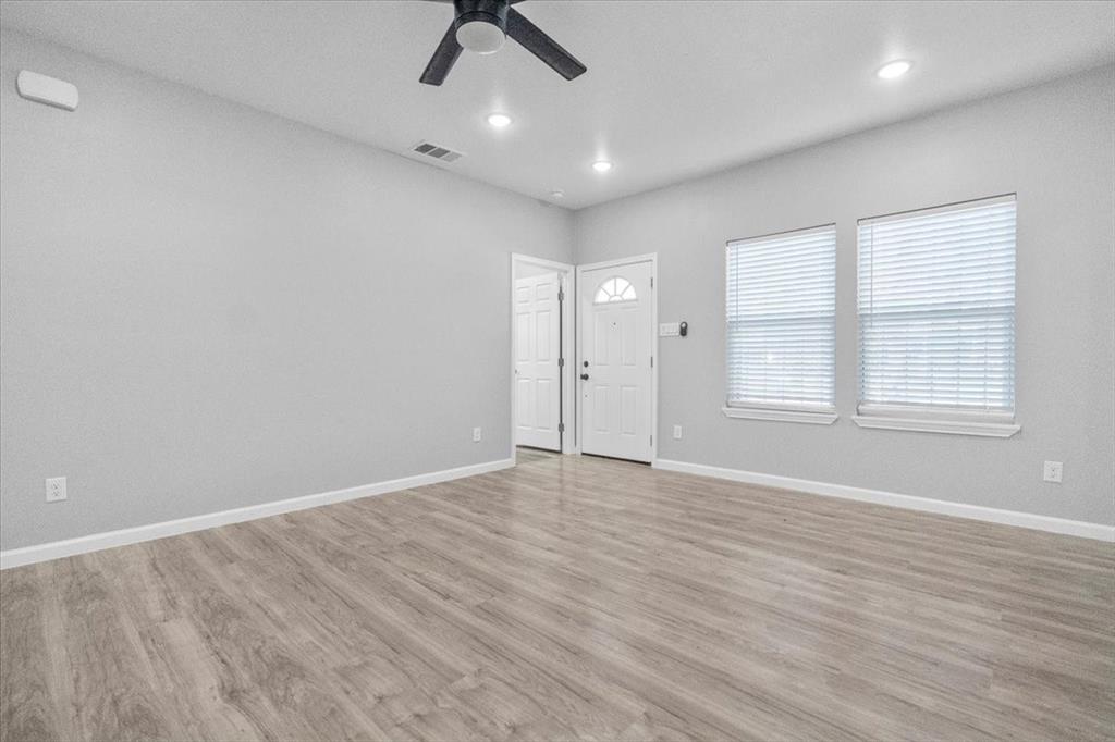 3512 Hamilton Avenue Dallas, TX 75210 - Photo 4 of 23 Unfurnished living room featuring light wood-type flooring, a ceiling fan, and recessed lighting