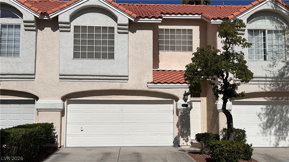 A well-maintained stucco facade tilroof welcomes you home.