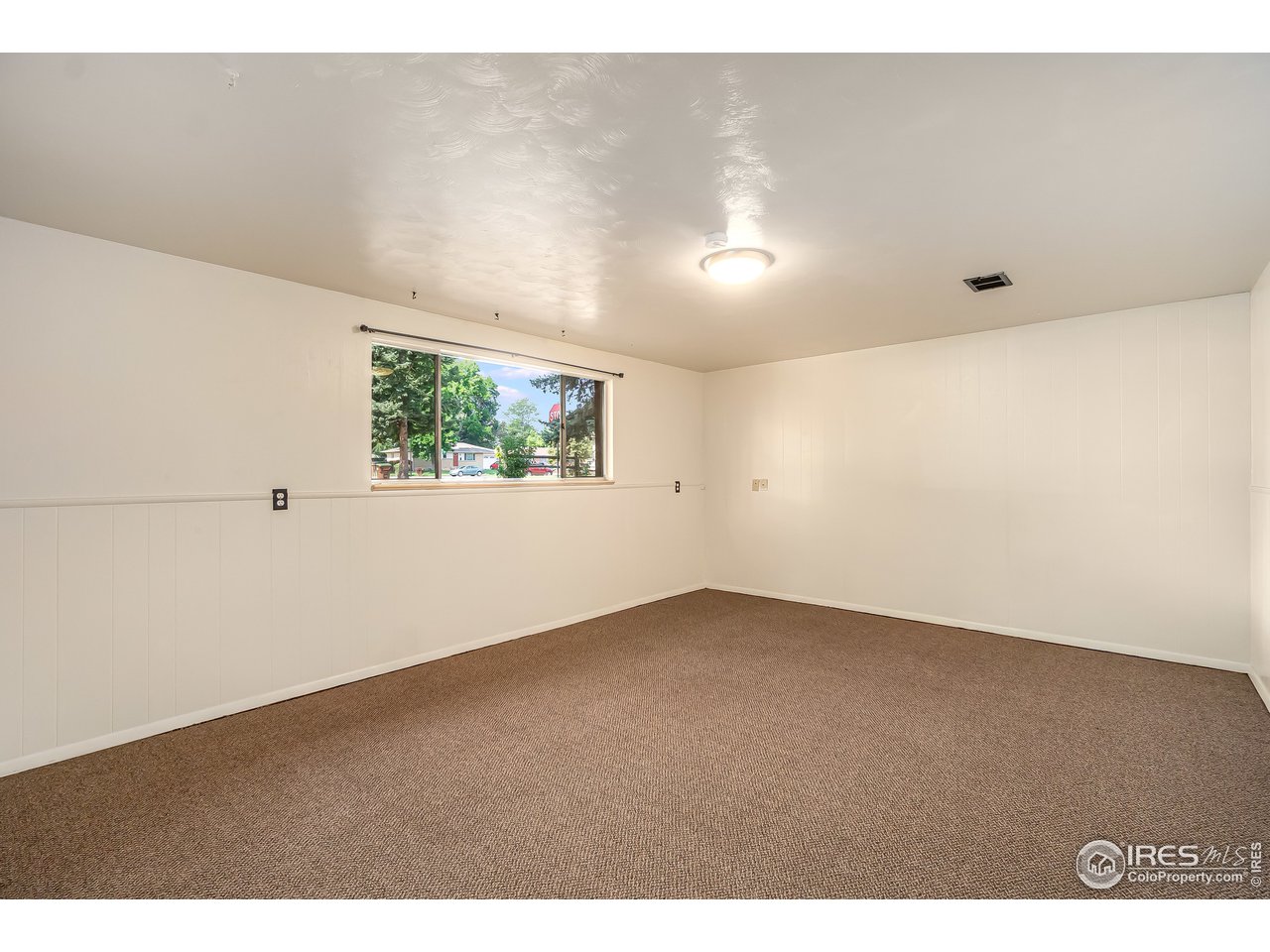 2416 Stanford Road Fort Collins, CO 80525 - Photo 23 of 36 Lower level family room / rec area