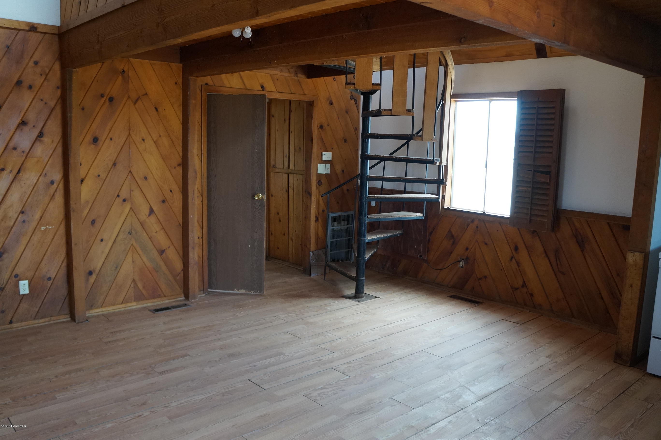 600 Ranch House Road Paulden, AZ 86334 - Photo 12 of 15 a view of a livingroom with wooden floor and stairs