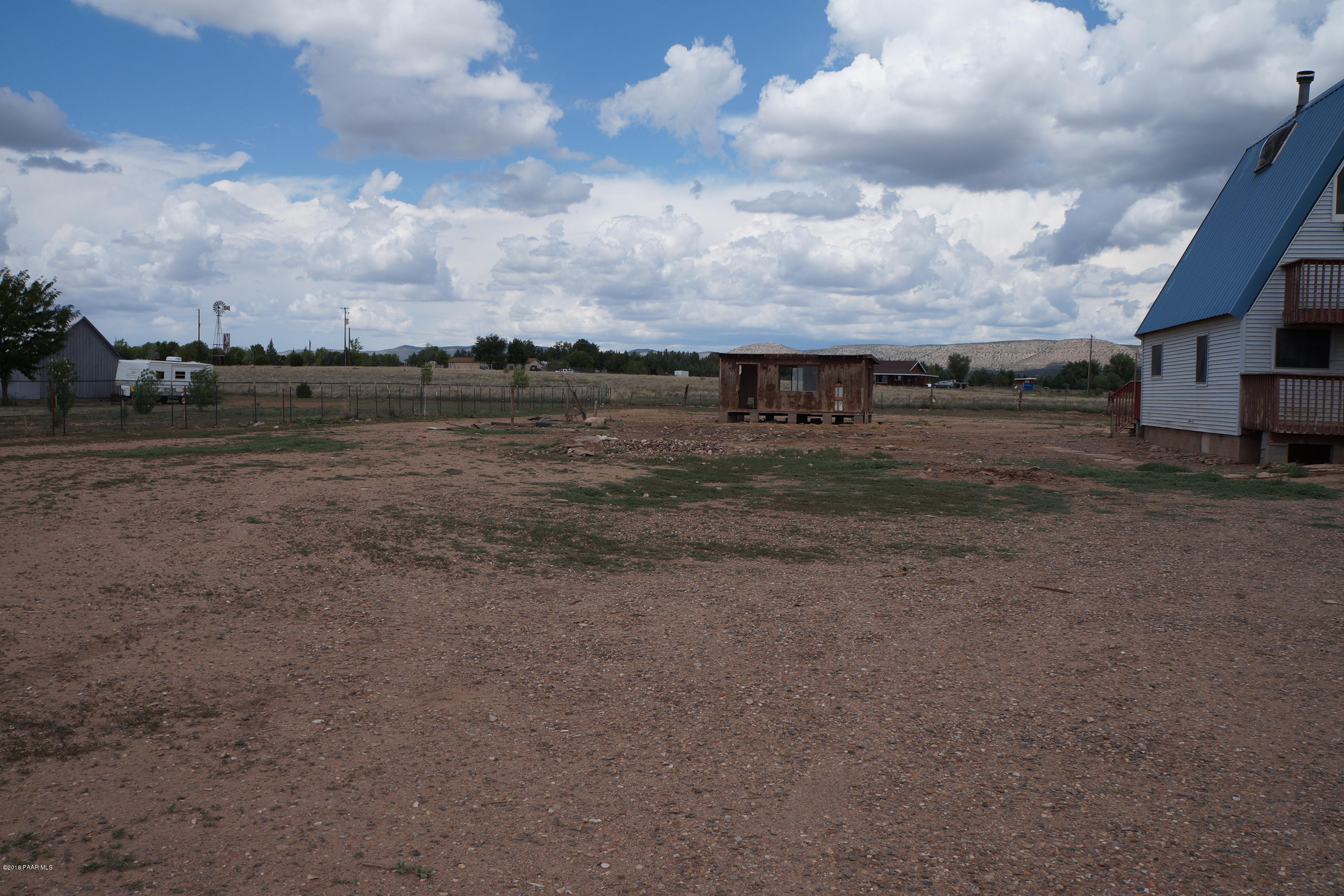 600 Ranch House Road Paulden, AZ 86334 - Photo 3 of 15 a view of a dry yard with wooden fence