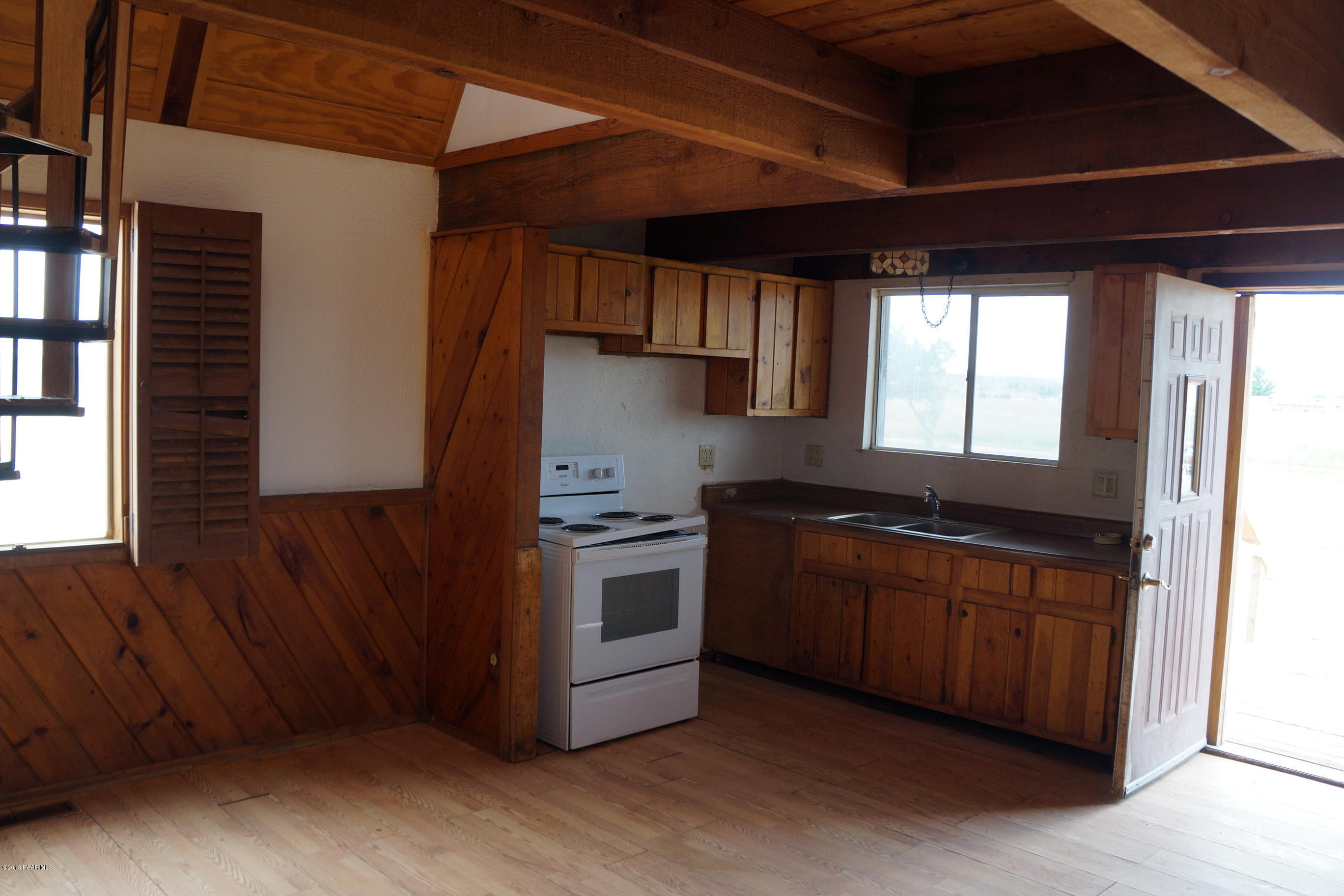 600 Ranch House Road Paulden, AZ 86334 - Photo 7 of 15 a kitchen with stainless steel appliances granite countertop a stove a sink and a refrigerator