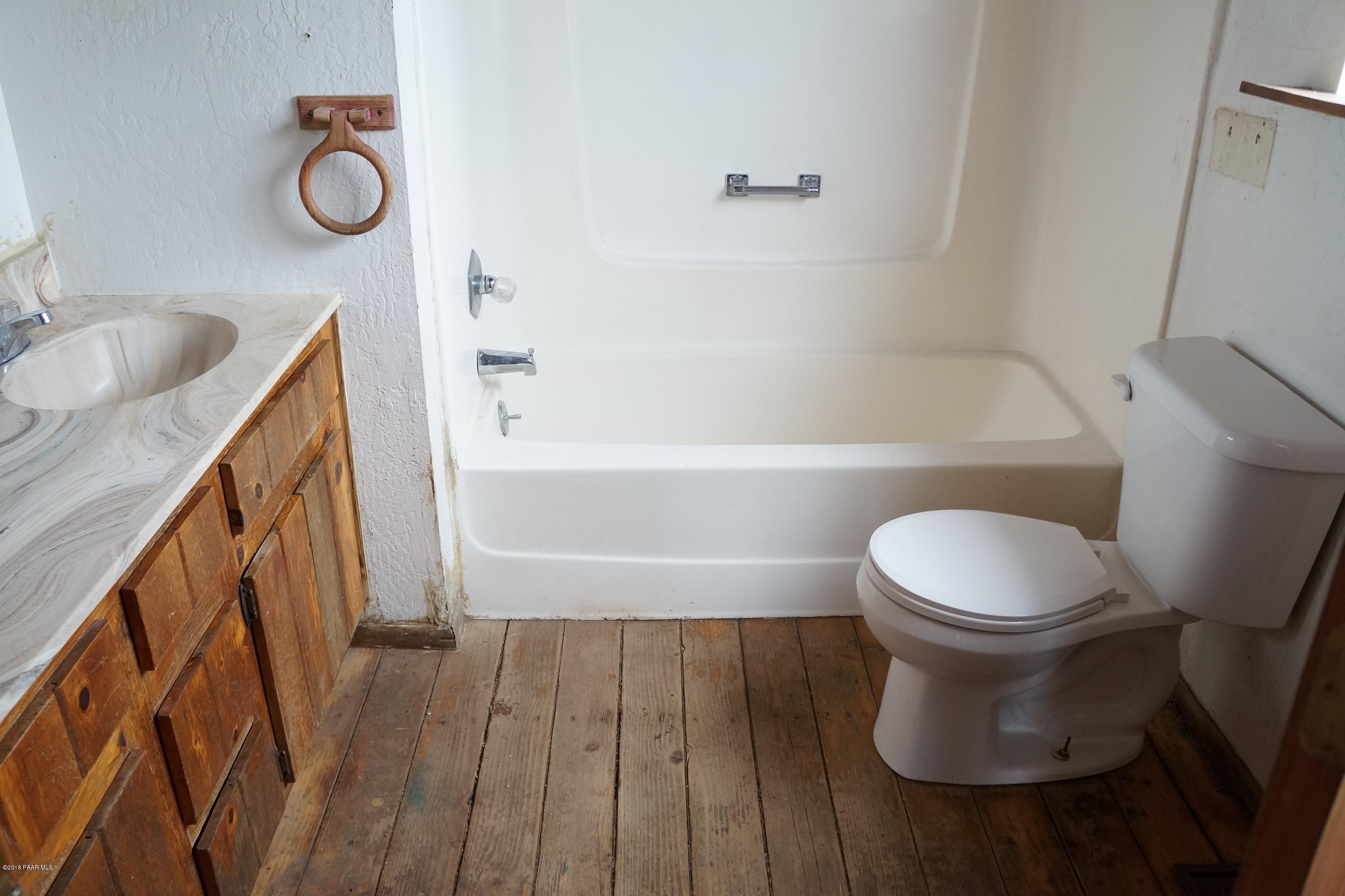 600 Ranch House Road Paulden, AZ 86334 - Photo 9 of 15 a toilet sitting next to a bathroom sink