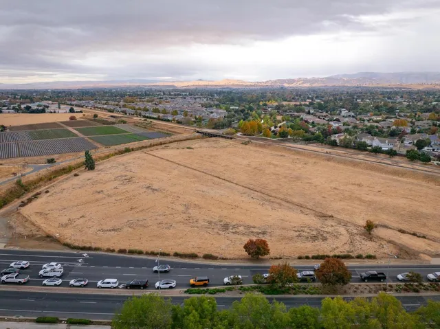 an aerial view of residential building and ocean view