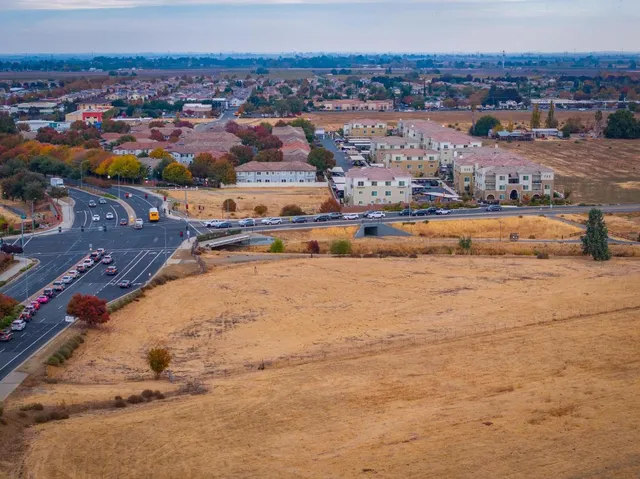 an aerial view of residential houses with outdoor space