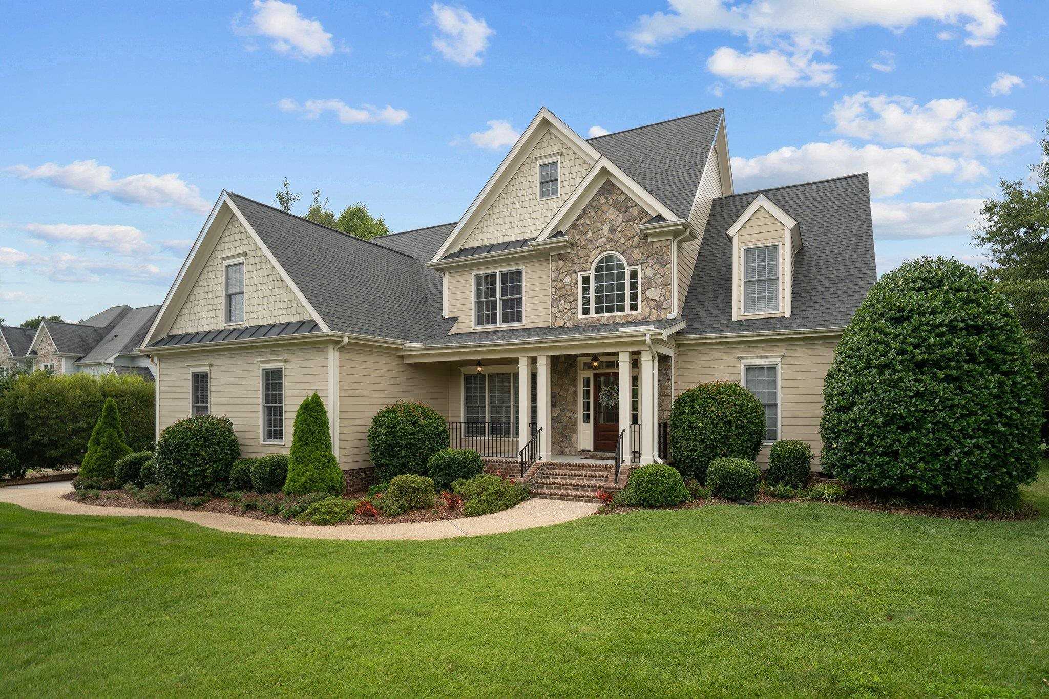 a front view of a house with a yard