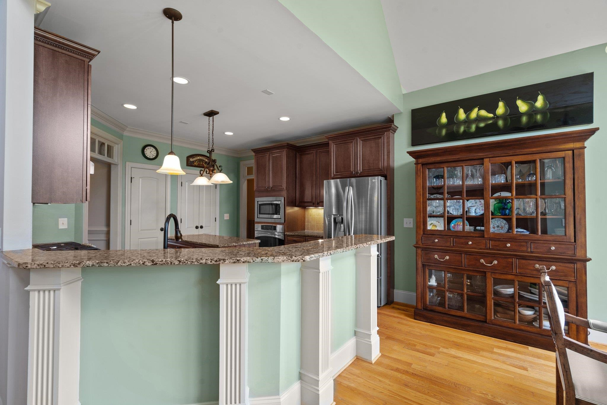 5805 Clovis Ridge Drive Wake Forest, NC 27587 - Photo 13 of 64 a kitchen with stainless steel appliances granite countertop a sink and a refrigerator