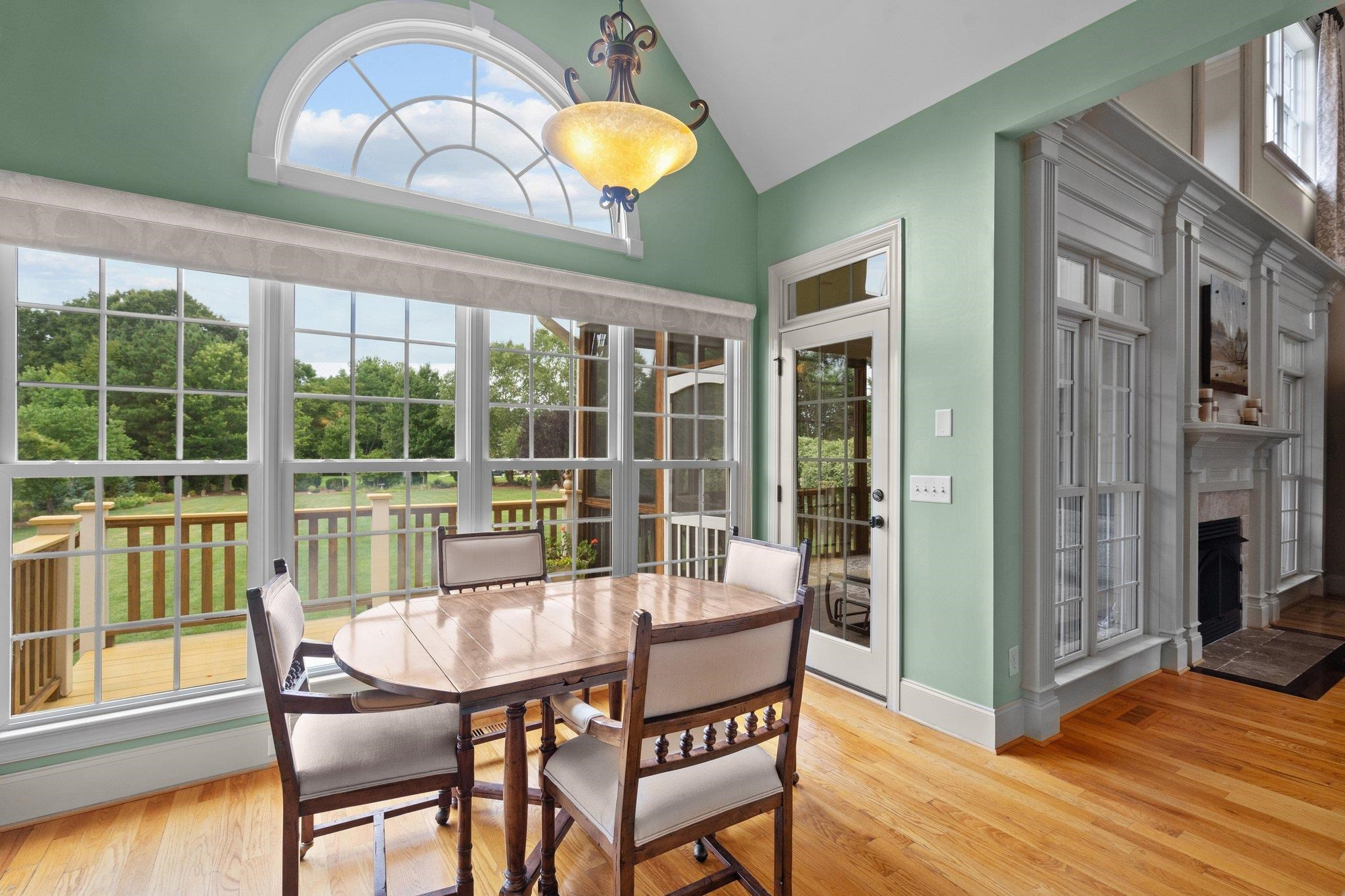 5805 Clovis Ridge Drive Wake Forest, NC 27587 - Photo 14 of 64 a dining room with furniture a chandelier and wooden floor