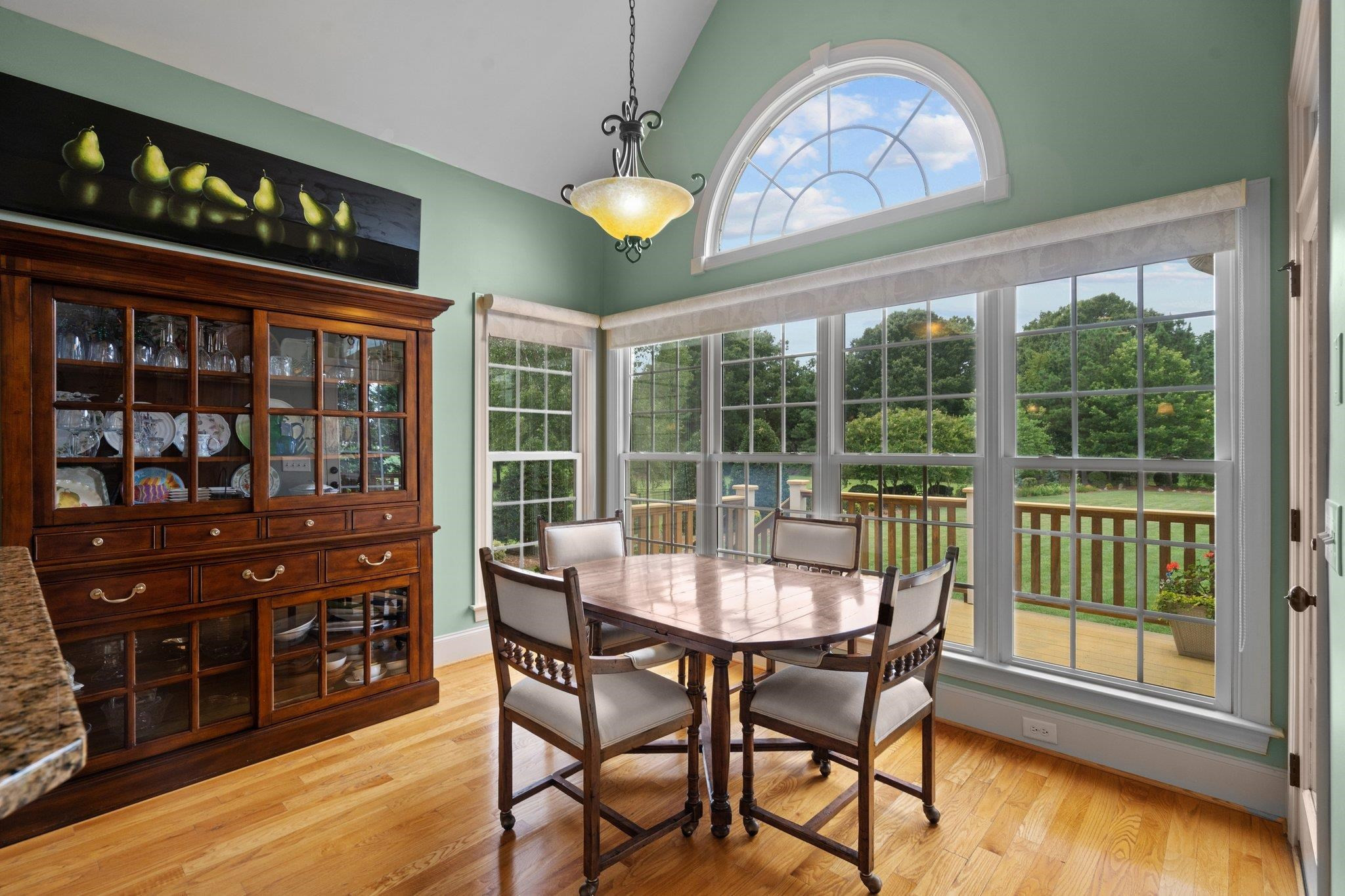 5805 Clovis Ridge Drive Wake Forest, NC 27587 - Photo 15 of 64 a dining room with furniture a chandelier and wooden floor