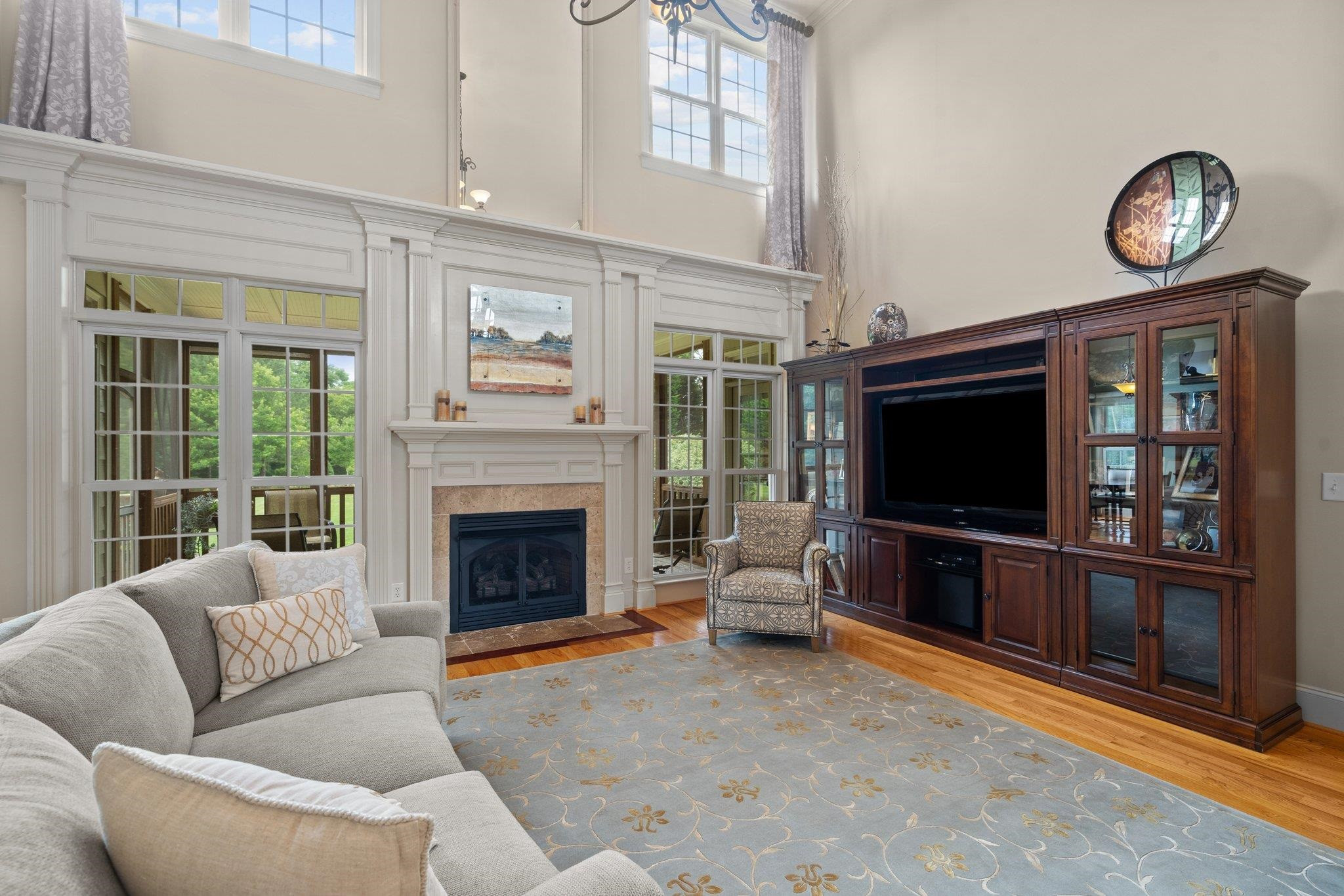 5805 Clovis Ridge Drive Wake Forest, NC 27587 - Photo 18 of 64 a living room with furniture a flat screen tv and a fireplace