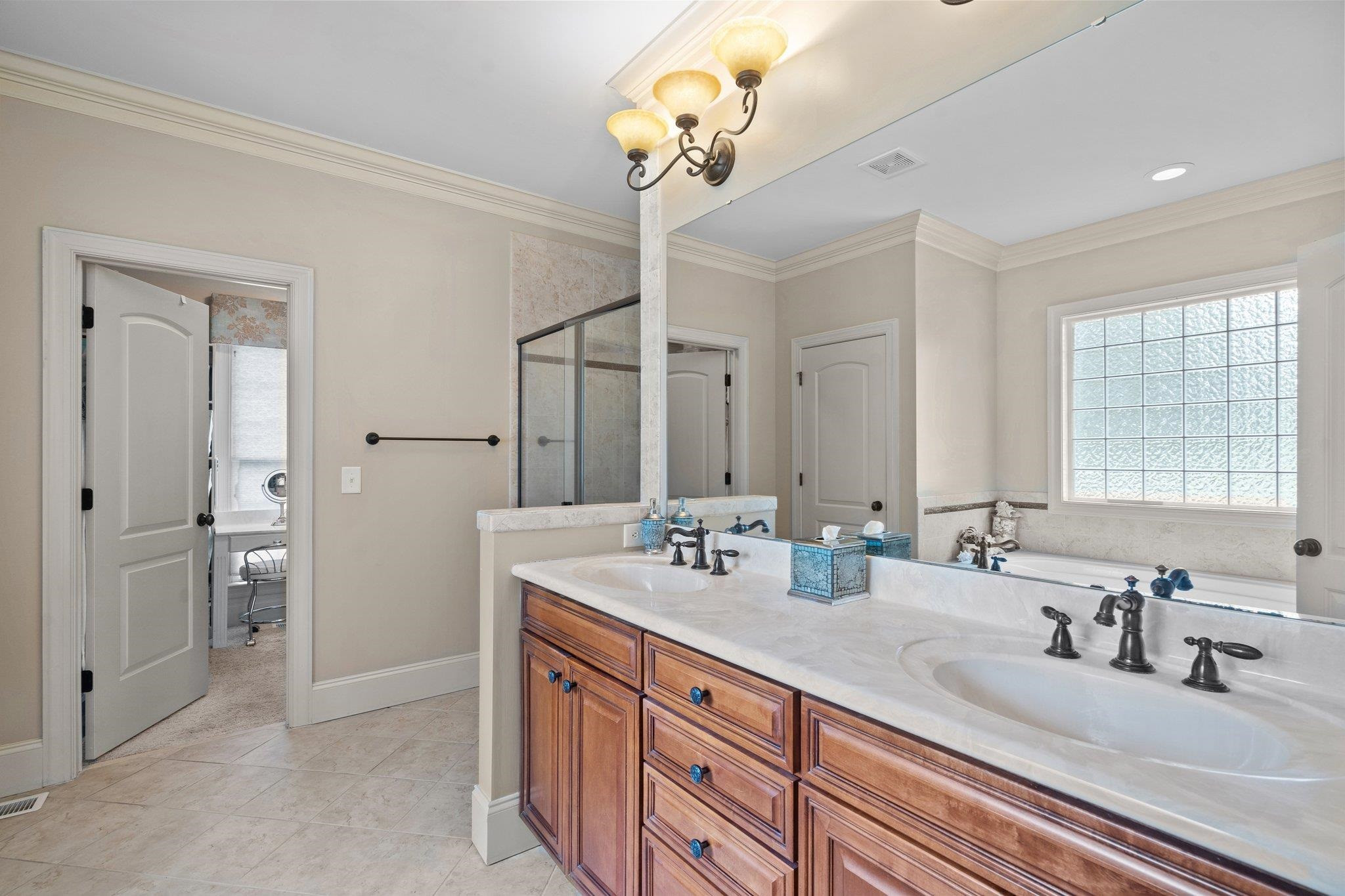 5805 Clovis Ridge Drive Wake Forest, NC 27587 - Photo 22 of 64 a bathroom with double vanity and a mirror