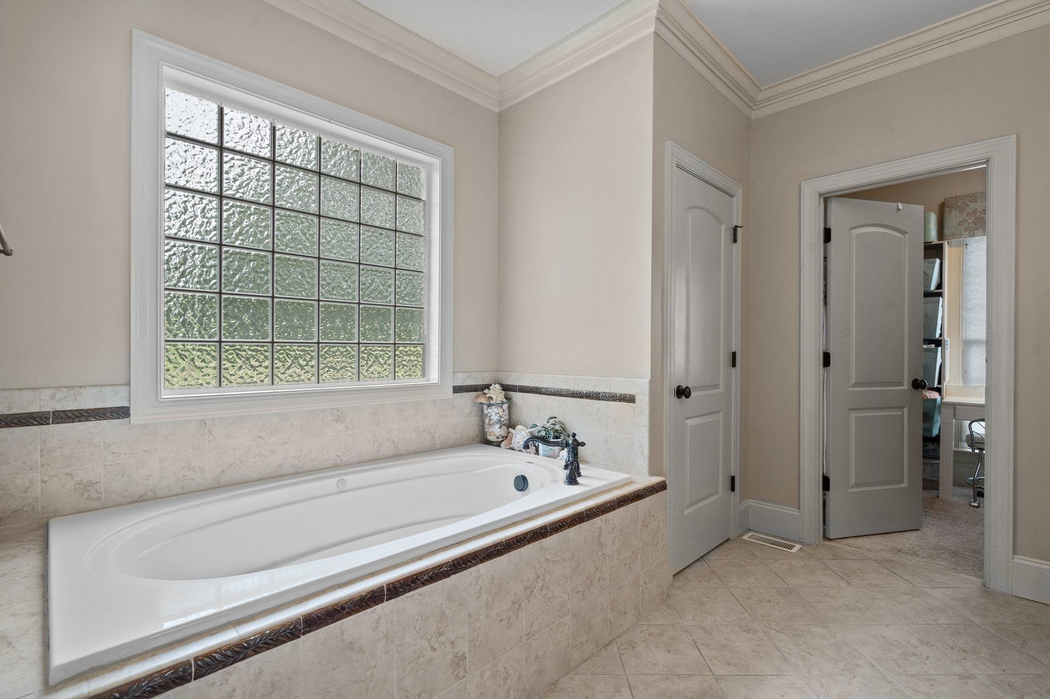 5805 Clovis Ridge Drive Wake Forest, NC 27587 - Photo 23 of 64 a bathroom with a bathtub and shower