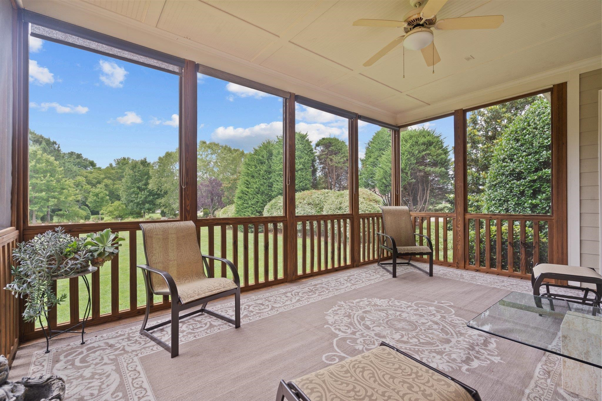 5805 Clovis Ridge Drive Wake Forest, NC 27587 - Photo 26 of 64 a living room with a floor to ceiling window and a table