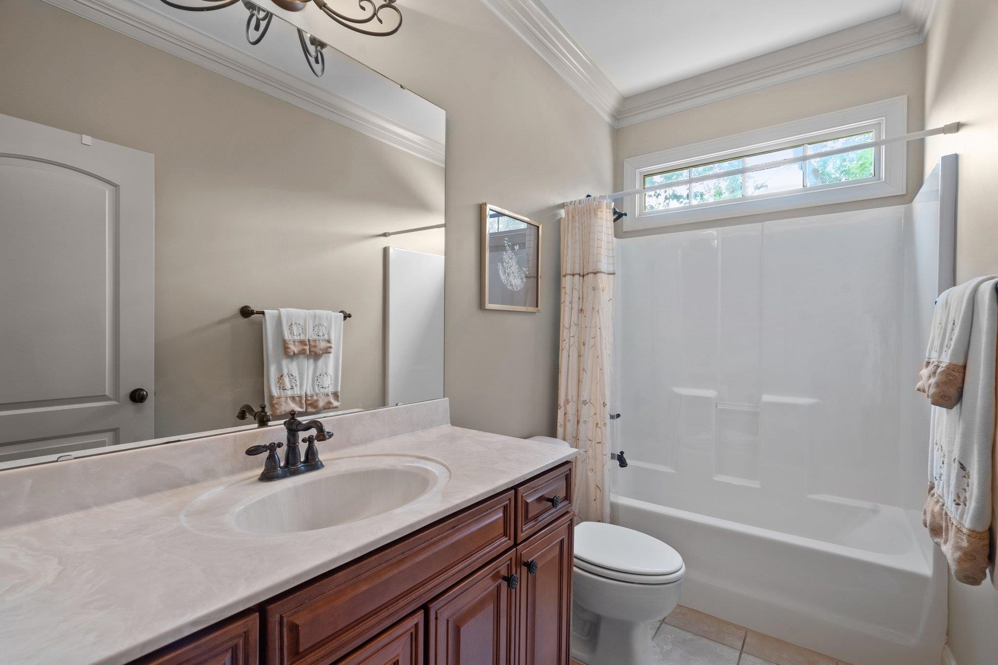5805 Clovis Ridge Drive Wake Forest, NC 27587 - Photo 29 of 64 a bathroom with a sink a toilet and shower