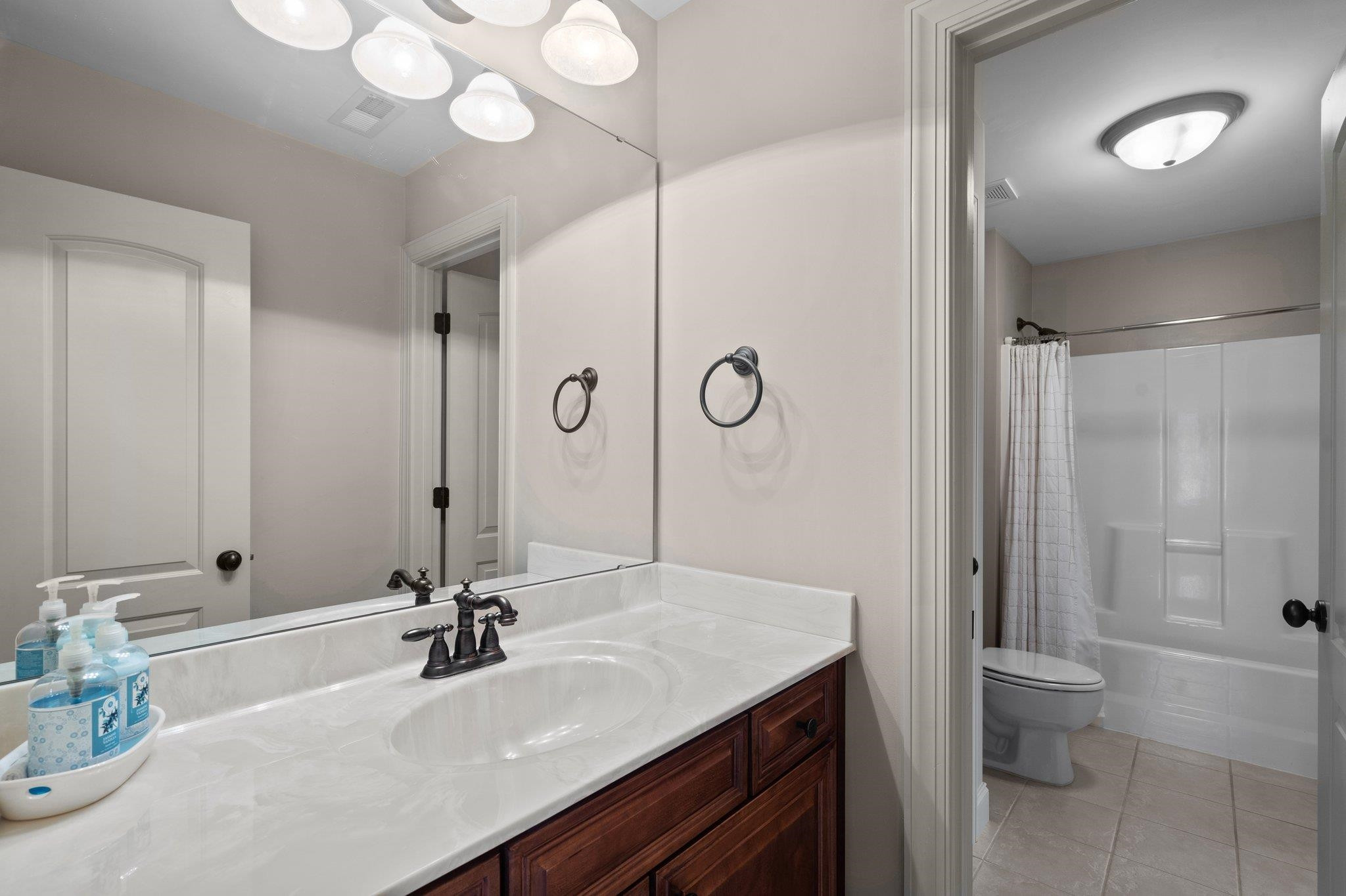 5805 Clovis Ridge Drive Wake Forest, NC 27587 - Photo 36 of 64 a bathroom with a sink and a mirror