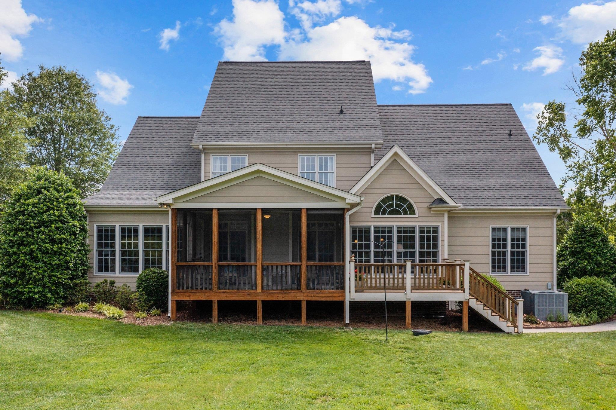 5805 Clovis Ridge Drive Wake Forest, NC 27587 - Photo 49 of 64 a front view of a house with a yard and potted plants