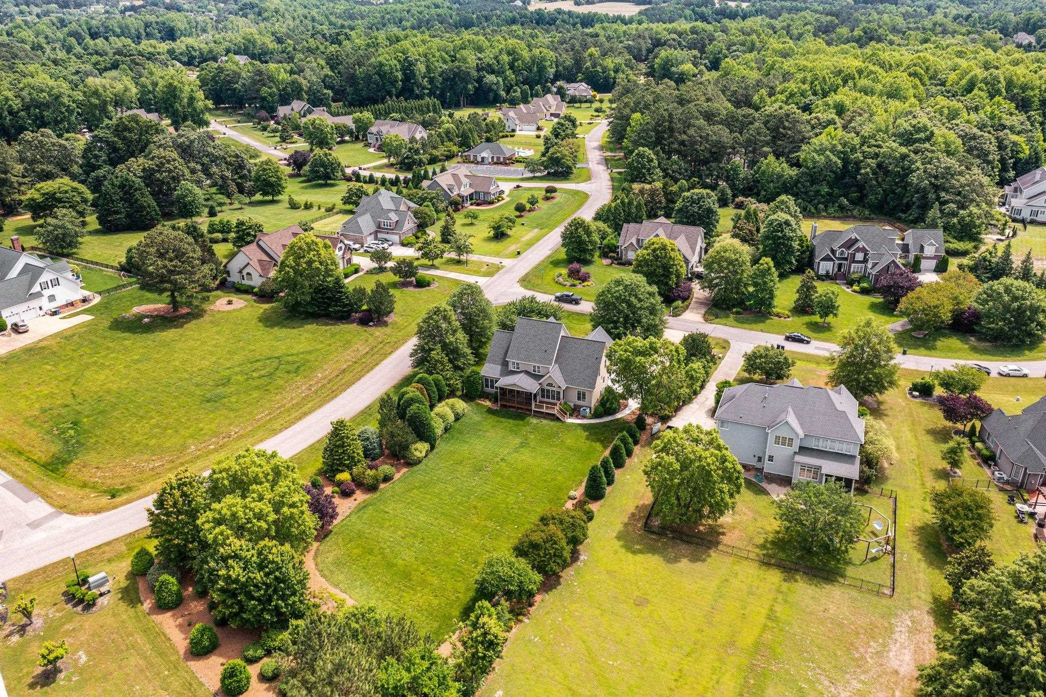5805 Clovis Ridge Drive Wake Forest, NC 27587 - Photo 59 of 64 an aerial view of residential houses with outdoor space