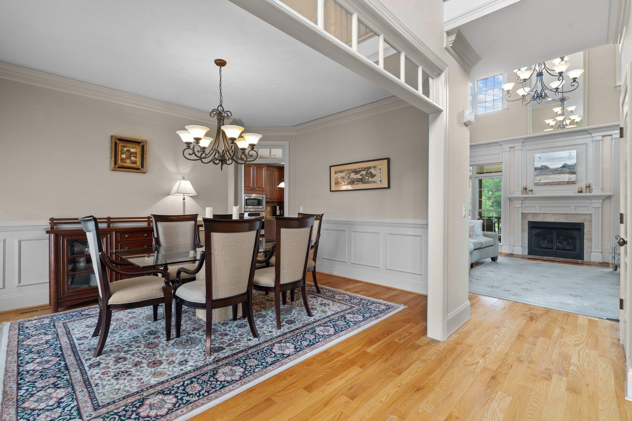 5805 Clovis Ridge Drive Wake Forest, NC 27587 - Photo 6 of 64 a view of a dining room with furniture a chandelier and wooden floor