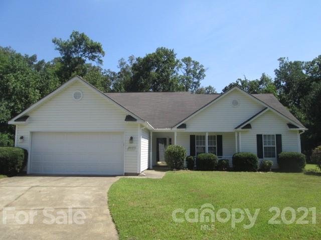 1941 Decatur Court Charlotte, NC 28213 - Photo 1 of 9 a front view of a house with a garden