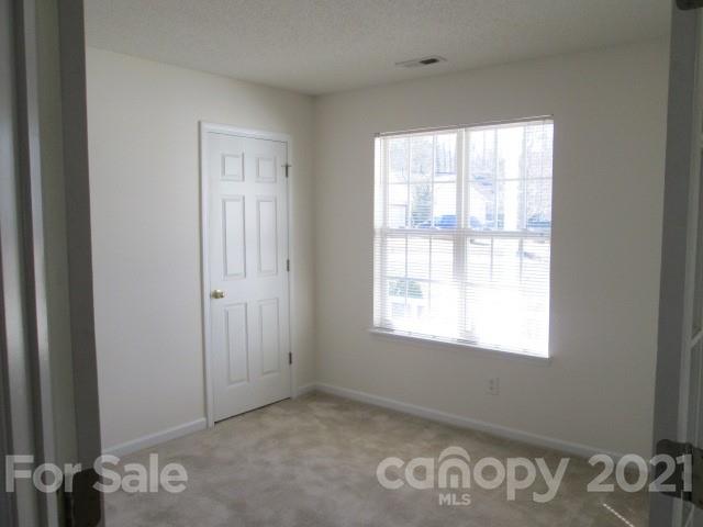 1941 Decatur Court Charlotte, NC 28213 - Photo 5 of 9 a view of an empty room with a window