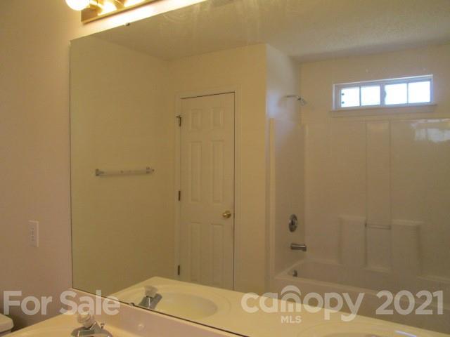 1941 Decatur Court Charlotte, NC 28213 - Photo 7 of 9 a bathroom with a sink and a mirror