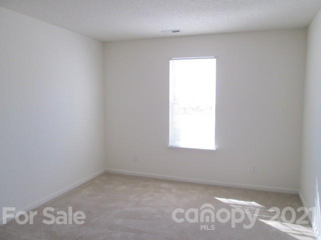 1941 Decatur Court Charlotte, NC 28213 - Photo 8 of 9 an empty room with a window