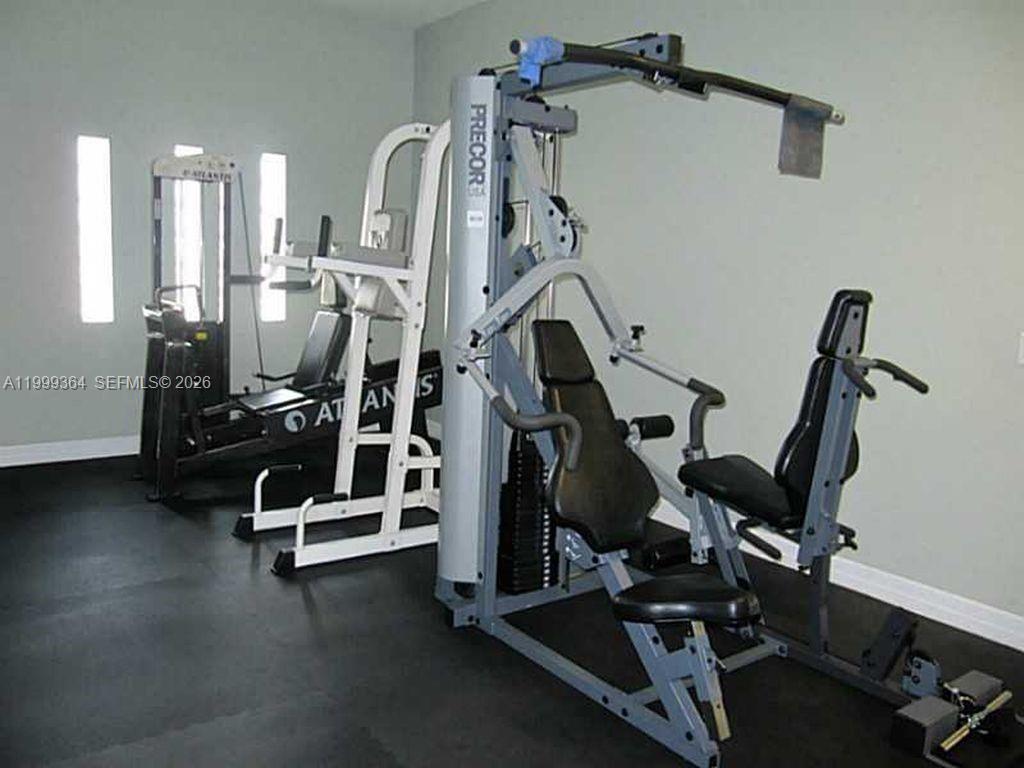 816 Northwest 11th Street, Unit 1002 Miami, FL 33136 - Photo 15 of 19 a view of a room with gym equipment