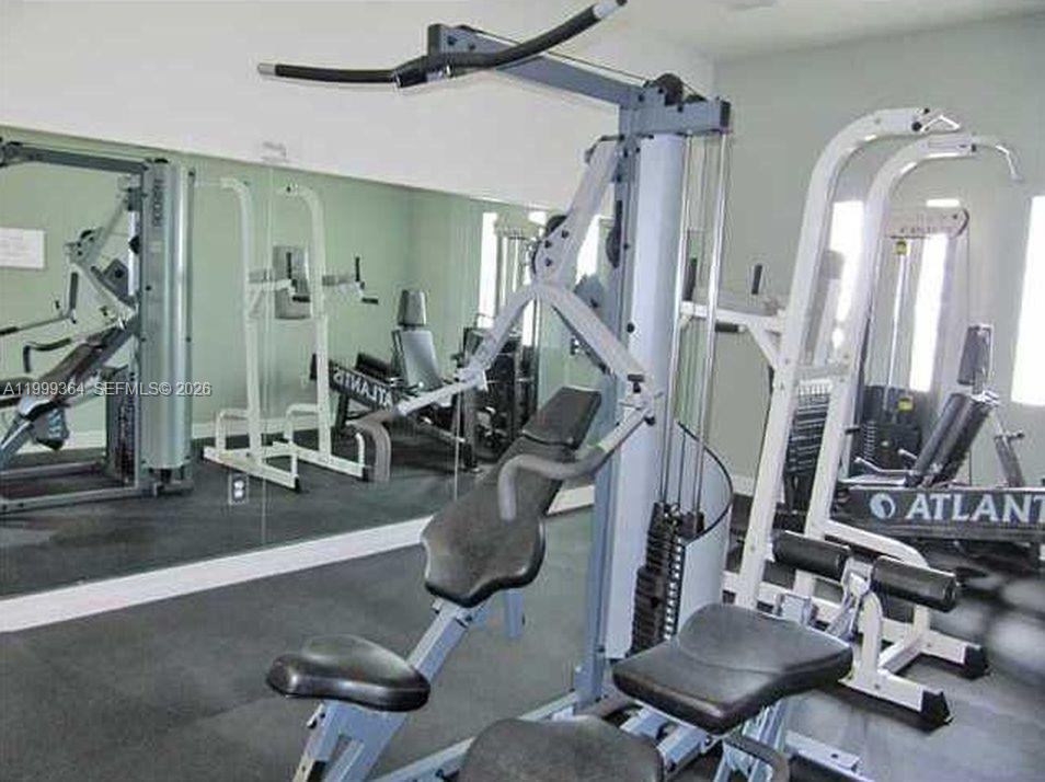 816 Northwest 11th Street, Unit 1002 Miami, FL 33136 - Photo 16 of 19 a view of a room with gym equipment