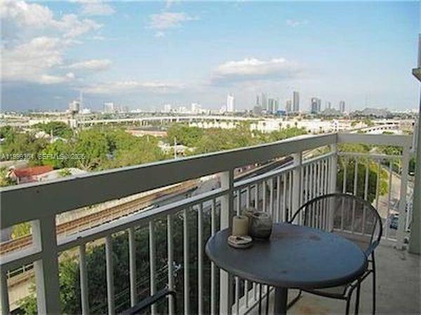 816 Northwest 11th Street, Unit 1002 Miami, FL 33136 - Photo 18 of 19 a view of a balcony dining space with furniture