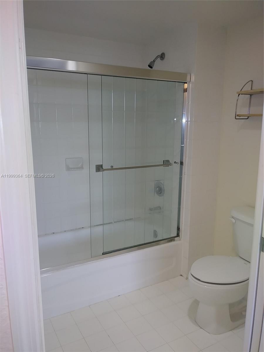 816 Northwest 11th Street, Unit 1002 Miami, FL 33136 - Photo 6 of 19 a bathroom with a toilet and a shower