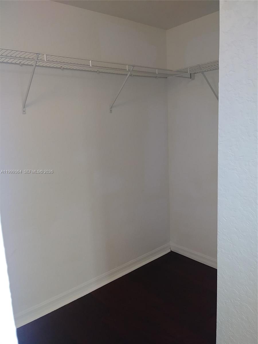 816 Northwest 11th Street, Unit 1002 Miami, FL 33136 - Photo 9 of 19 a view of a room with shelf on the wall