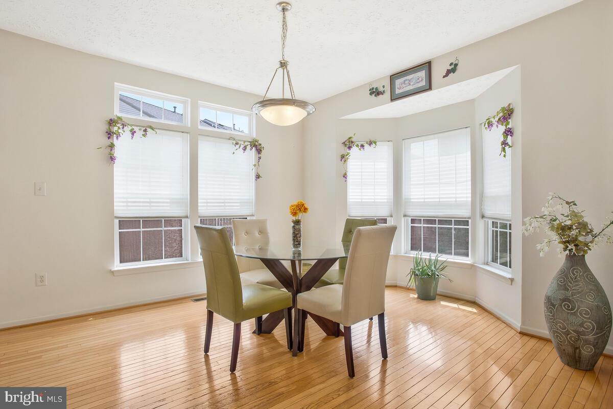 2002 Regiment Way Odenton, MD 21113 - Photo 12 of 44 Dining Room with hardwood floors & transom windows
