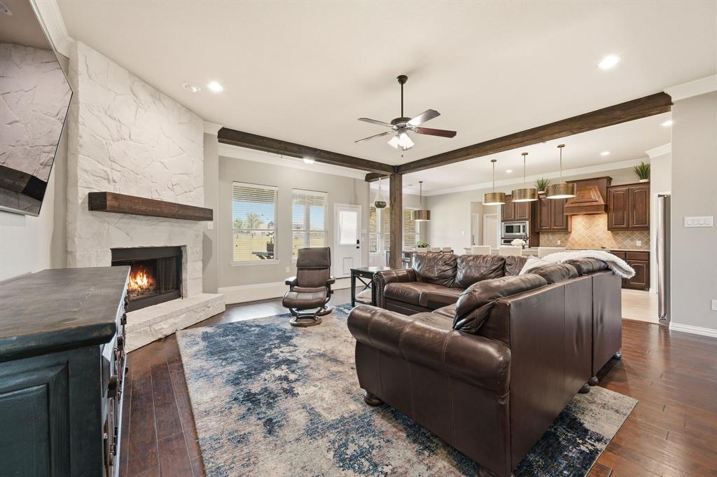 140 Heather Lane Decatur, TX 76234 - Photo 11 of 39 a living room with furniture and a fireplace