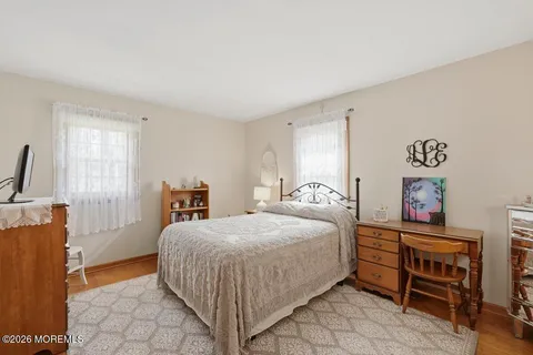 a bedroom with a bed and a table in it