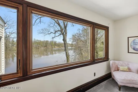 a living room with a large window and a couch