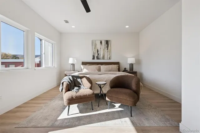 a bedroom with furniture and a window